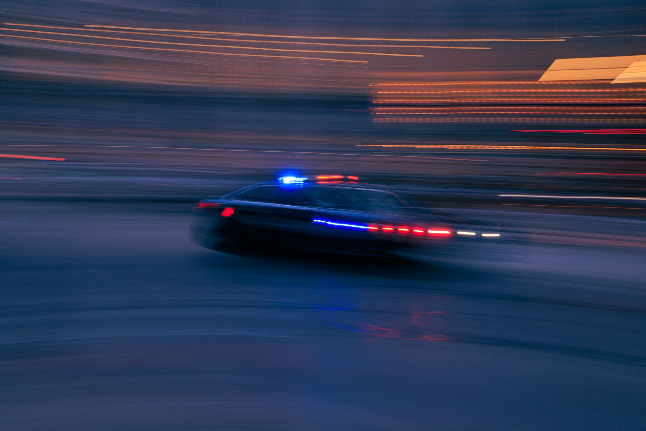 Police car responding at night